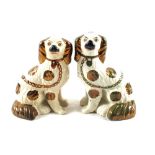 A matched pair of Victorian Staffordshire copper lustre dogs