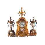 A 19th Century French gilt metal clock garniture, the clock with cherub and face decoration,