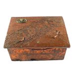 A beaten Copper slipper box