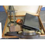 A suitcase containing a Bakelite sextant,