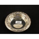 A Samuel Kirk & Sons circular Silver dish with floral embossed rim, No.