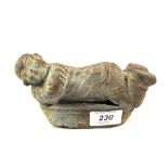 A Chinese Bronze figure of a reclining child,