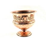 An Arts and Crafts embossed Copper jardinière with pedestal base,
