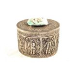 A Chinese oval lidded box with figure decoration and turquoise mount to lid,