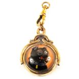 A Gold plated swivel fob with cabochon glass dogs head decoration