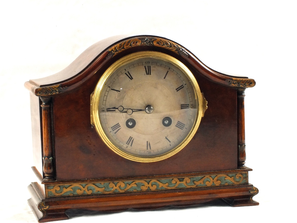 An Edwardian Walnut striking mantel clock