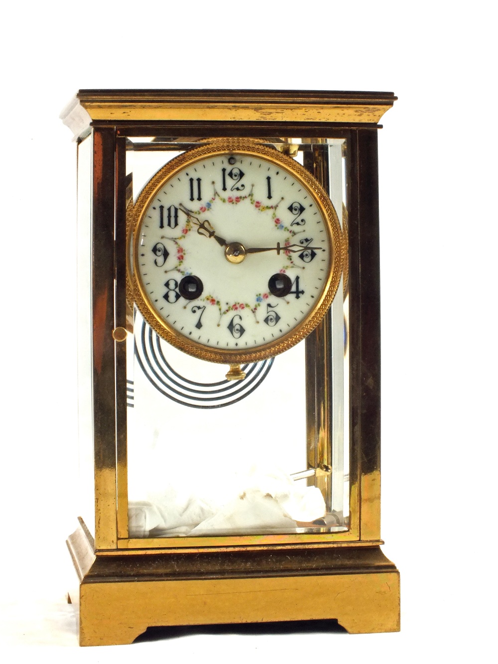 A Brass cased four glass striking mantel clock with painted enamel dial