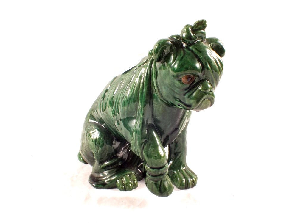 A green glazed Bretby Bulldog with bandaged eye,