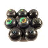 A case containing eight lawn bowls