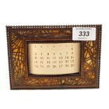 A Tiffany pierced Copper calendar No.