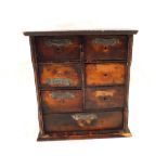 A Victorian wooden spice chest