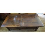 A rectangular dark stained Oak coffee table with two drawers