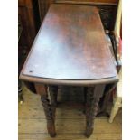 An oval Oak gate leg table and a Mahogany triple dressing table mirror