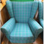 A pair of modern green tartan armchairs and a salmon upholstered wingback armchair