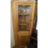 A modern Pine glazed door corner cupboard