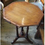 A Victorian octagonal occasional table on three column support