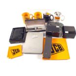 Various JCB promotional items including Parker pen, models,