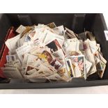 A box of various cigarette cards