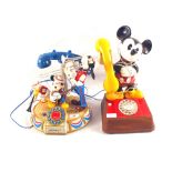 Two Mickey Mouse telephones