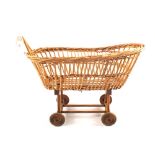 A wicker dolls pram