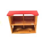 A wooden open front dolls house