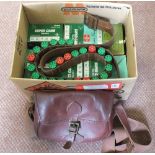 Approx two hundred and fifty 12 bore cartridges with a leather cartridge belt and bag,