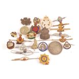 A collection of sweetheart and lapel badges