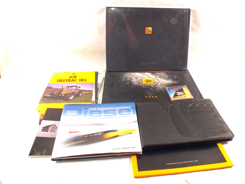 A JCB bag containing calendars and promotional literature