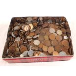 A tin of mixed world coins