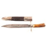 A good mid 19th Century Bowie knife with antler grips and white metal guard,