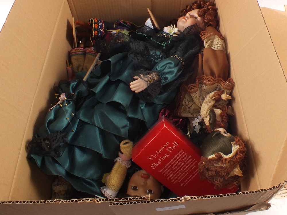 Two boxes of various dolls