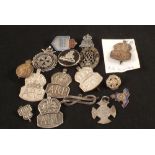 A collection of badges, mainly silver examples including A.R.P.