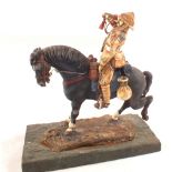 A model of Boar War Officer on horseback on a plinth