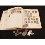 A Triumph album of world stamps and a few coins