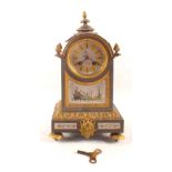 A gilt metal mounted striking mantel clock with painted panels by H.