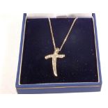 A 9ct White Gold Diamond set cross pendant on a 9ct Gold White Gold chain