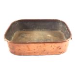A heavy 19th Century oblong twin handled seamed Copper roasting pan with makers stamp for Benham &