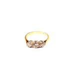 An 18ct Gold three stone Diamond ring,