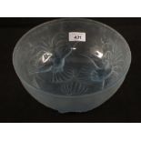 A blue glass bowl with relief bird decoration,