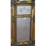 A gilt mirror with cherub decoration with a lady and child relief