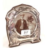 An Art Nouveau Silver photo frame with embossed bird and floral decoration,