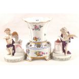 A pair of continental winged cherub ornaments plus a vase (all as found)