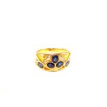 A Gold band ring set with oval Sapphires and Diamonds (unhallmarked, resized),