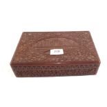An Indian carved box containing a Silver watch chain,