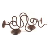 A pair or wrought iron wall candle holders,