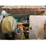 A fishing basket containing various tackle including Penn Squidder,