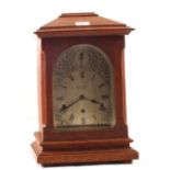 A German Oak cased striking mantel clock with silvered dial, marked Aitchison Bros,