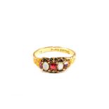 A 15ct Gold Opal and red stone set ring (repaired),