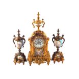 A 19th Century French gilt metal clock garniture, the clock with cherub and face decoration,