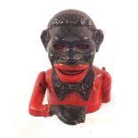 A cast iron ethnic boy money box